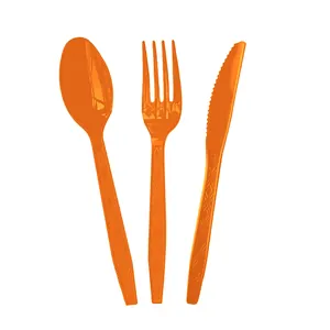 Set of orange disposable plastic cutlery including spoon, fork, and knife for party
