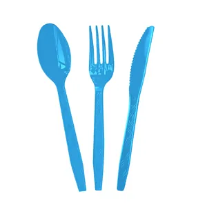 Detailed view of bright blue disposable plastic fork, spoon and knife set with patterns