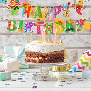 Mexican Fiesta Happy Birthday banner displayed over a chocolate cake and party gifts
