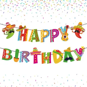 Detail view of colorful Mexican fiesta happy birthday banner with cactus and taco motifs
