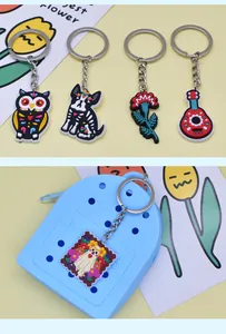 Close-up of colorful Day of the Dead PVC keychains showing fine detail and vibrant colors