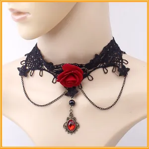 Detail of Gothic black lace choker with a large red rose and vintage ruby pendant
