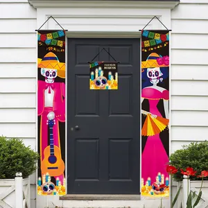 Detailed view of Mexican Day of the Dead banner set hanging on a dark blue door
