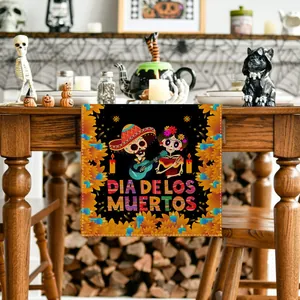Detailed view of linen table runner with Mexican Day of the Dead skulls in a festive setting