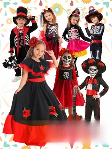 Detailed view of Mexican Day of the Dead children's costumes with skeleton prints