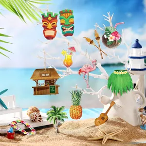 Decorative tropical Luau wooden ornaments hanging on white branch at the sunny beach