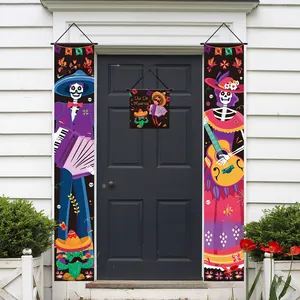Detail of Day of the Dead door banners featuring colorful skeletons and instruments