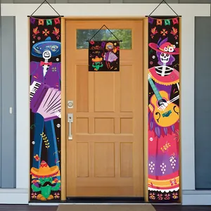 Detailed view of Mexico Day of the Dead skeleton door banners on a wooden entrance