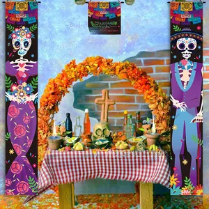 Detailed view of Dia de Muertos banners displayed in a traditional festive altar setting