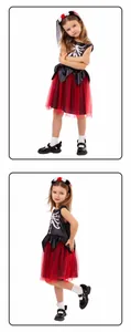 Detailed view of child Halloween Day of the Dead skeleton costume with red tutu skirt.