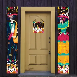 Vibrant Day of the Dead banner set with skeleton characters hanging on a wooden door.