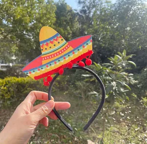 Detailed macro shot of a Mexican sombrero party headband with colorful patterns and pom-poms