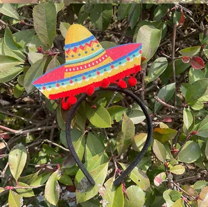 Detailed view of a glittery Mexican sombrero headband for Cinco de Mayo party decor