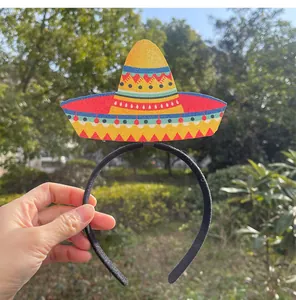 Detailed view of a vibrant Mexican sombrero party headband held against a natural background