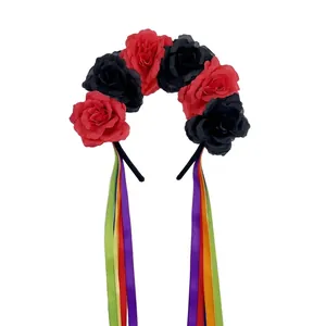 Detail view of Mexican rose headband with red and black flowers and colorful ribbons