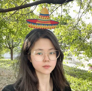 Female model wearing a colorful Mexican sombrero headband in an outdoor setting