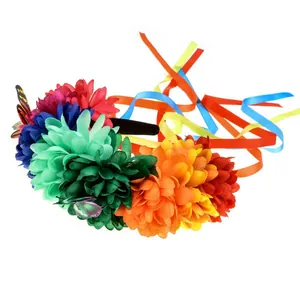 Close-up side view detail of a vibrant Mexican floral headband with colorful ribbons