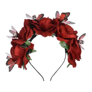 Close-up detail of Mexican festival headband with red roses, butterflies and skulls
