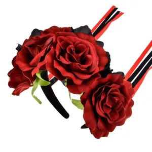 Detailed close-up view of a Mexican style red fabric rose headband with ribbon streamers