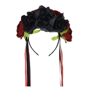 Detailed view of large black and red roses on Mexican festive headband with ribbons