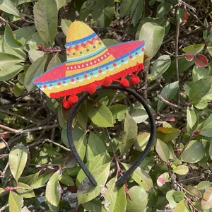 Mexican party headband with glitter sombrero and red pom-poms for Cinco de Mayo