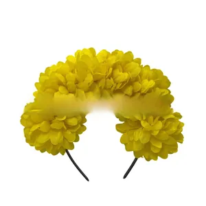 Close-up detail showing the dense yellow fabric flowers on a black headband frame.