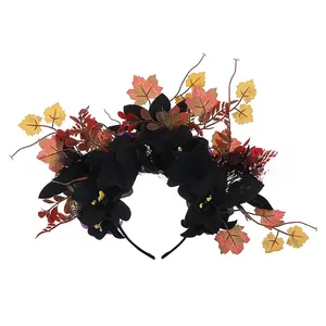 Detailed view of Halloween headband with black flowers and autumn maple leaves