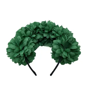 Detail of a dark green artificial fabric flower headband for Halloween and festivals