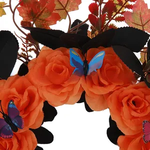 Close-up of Halloween headband with orange roses and colorful butterflies.