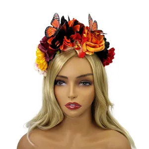 Detailed macro view of Mexican style floral headband with vibrant orange butterfly accents
