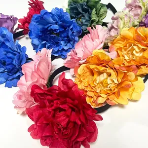 Detailed view of colorful 12cm large artificial camellia headbands for parties