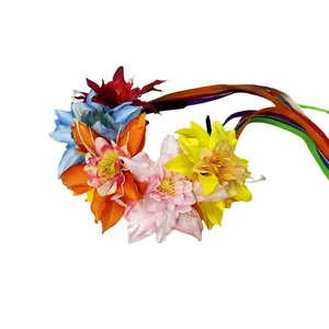 Close-up detail of a colorful Mexican floral headband with flowing rainbow silk ribbons