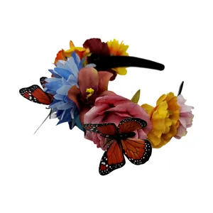 Close-up detail of Mexican floral headband with vibrant roses and monarch butterflies