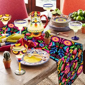 Detailed view of vibrant Mexican floral table runner on a festive party dinner table