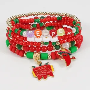 Close-up of Cinco de Mayo beaded bracelet set with pepper and Happy Fiesta charms.