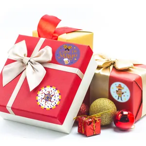 Cinco De Mayo round party stickers shown on beautifully wrapped red and gold gift boxes