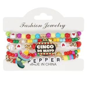 Close-up detail of colorful Cinco de Mayo beaded bracelet set with chili pepper charm