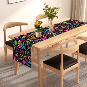 Vibrant Mexican party table runner with colorful floral Day of the Dead patterns