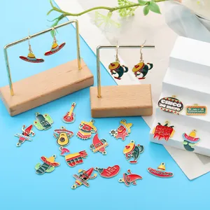 Close-up view of various Mexican Fiesta enamel pendants and earrings on display stands.