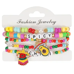 Colorful Cinco de Mayo beaded bracelet set featuring spicy chili and avocado charms.