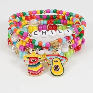 Detailed view of colorful Cinco de Mayo beaded bracelets with chili and avocado charms