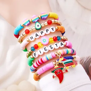 Detail of colorful Cinco de Mayo charm bracelets featuring chili and piñata pendants