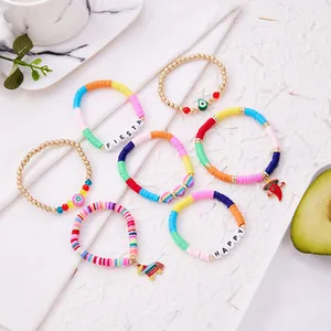 Detailed close-up of Mexican fiesta bracelet set featuring colorful clay and gold beads