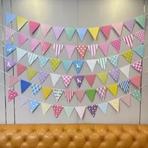 Detailed view of colorful triangular bunting banners for birthday party decoration.