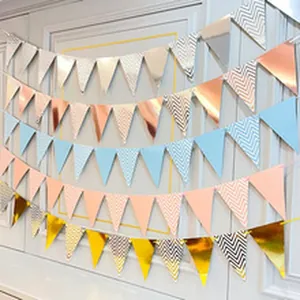 Detailed view of colorful triangular party bunting banners with chevron patterns.