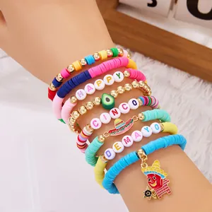 Close-up of colorful Cinco de Mayo bracelet set with pinata and sombrero charms.