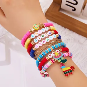 Close-up detail of Cinco de Mayo clay bead bracelets featuring piñata and sombrero charms.