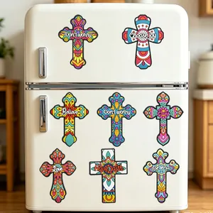 Colorful Mexican Day of the Dead cross fridge magnets displayed on a white refrigerator