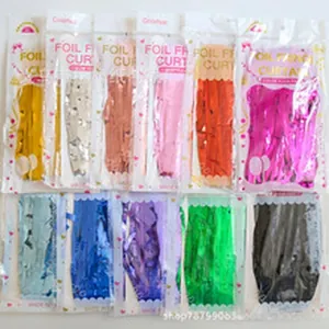 Colorful foil fringe curtains for party decor shown in various vibrant colors