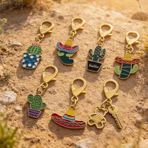 Macro view of colorful Mexican fiesta themed metal enamel charms with lobster clasps.